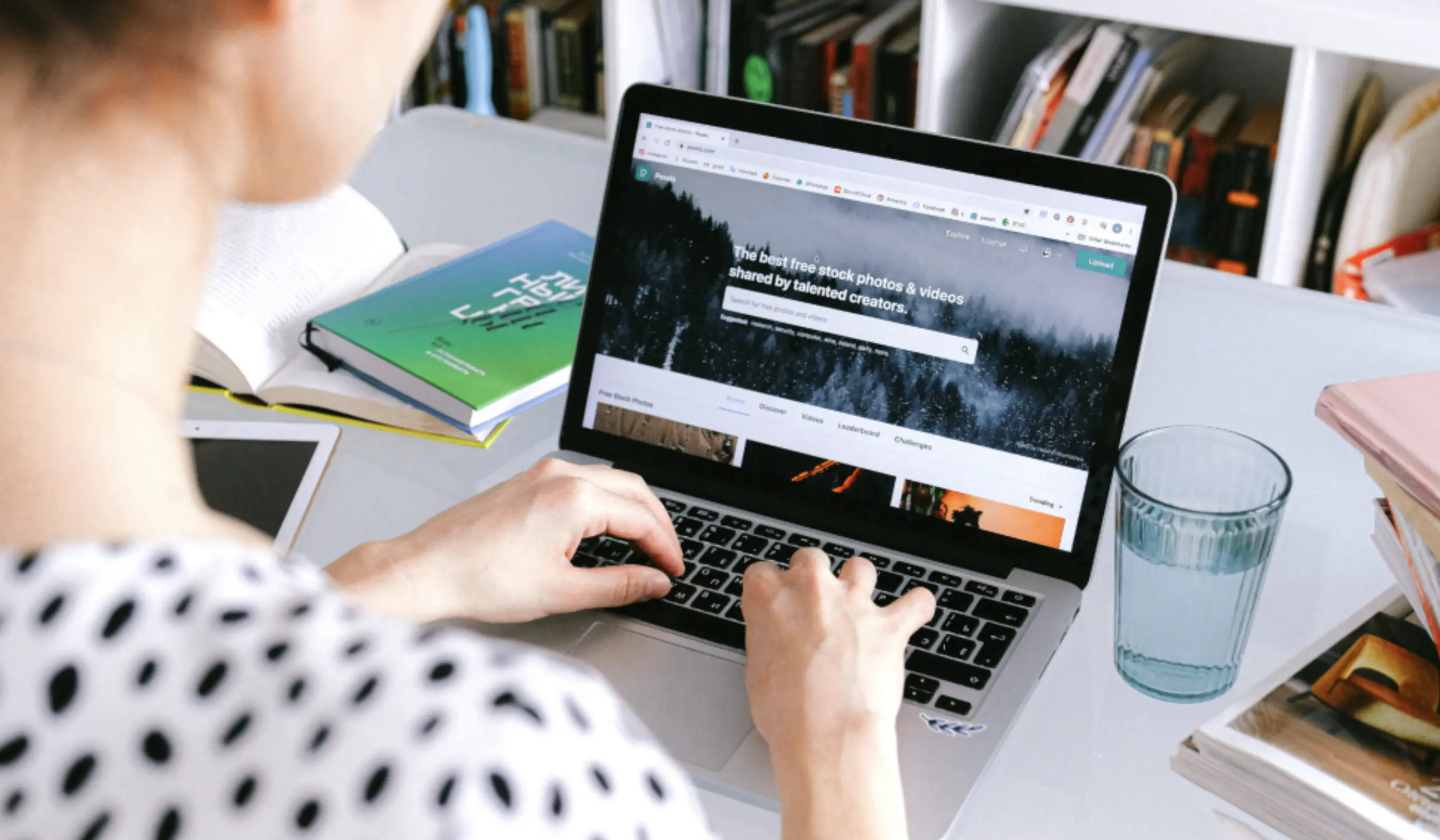 Adult researching affordable life insurance options online on laptop in modern home office